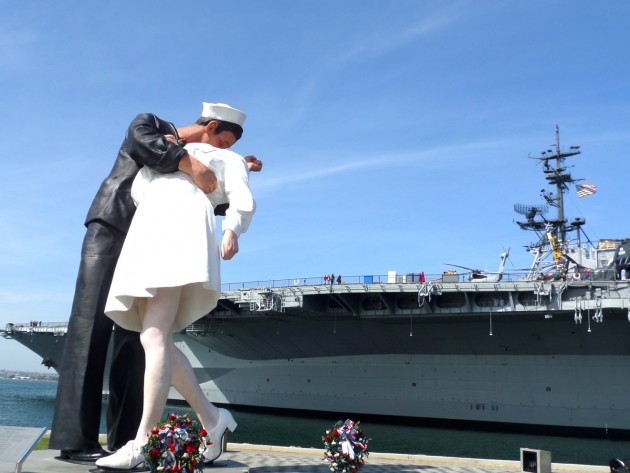 The Unconditional Surrender statue with the USS Midway Aircraft Carrier Museum in the background.